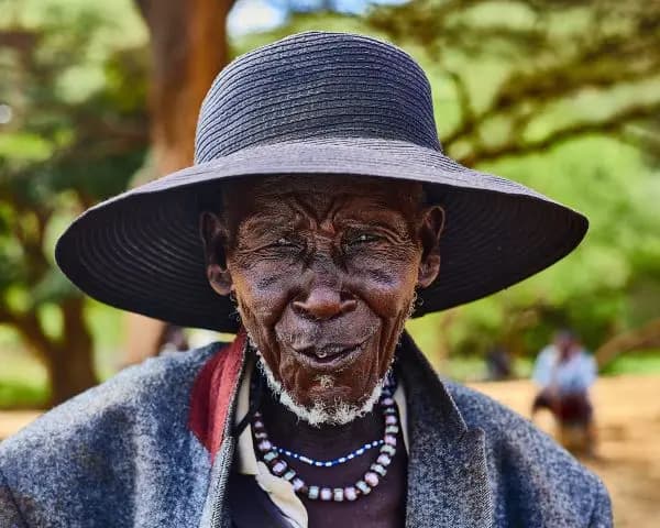 An elder man from the community smiling warmly