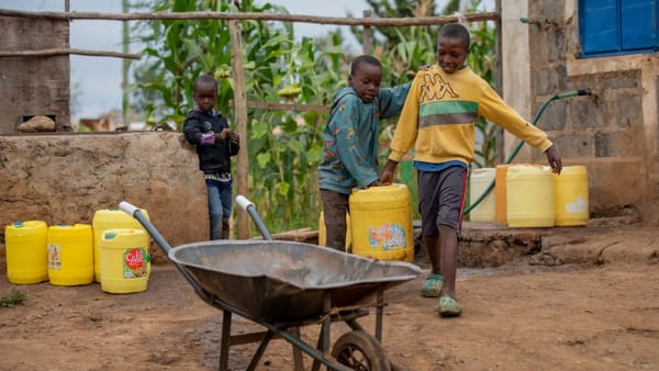 children buying water at a water dispensing station in Murang'a Kenya